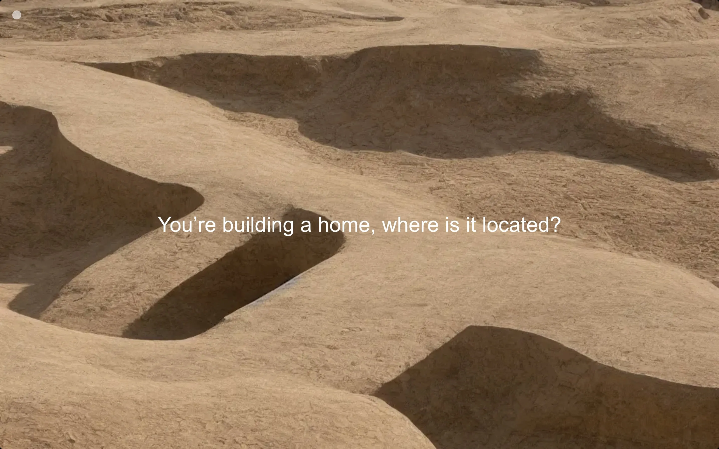 website with a background and text that says 'You're building a home, where is it located?'